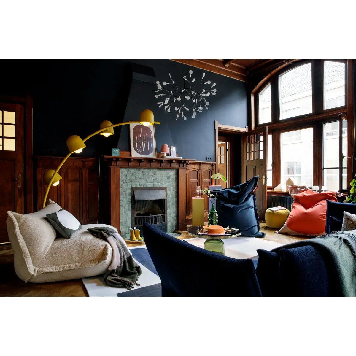 A living room featuring Fatboy Big Lebow floor lamp, Bonbaron Sherpa bean bag, and Slim Teddy bean bags.