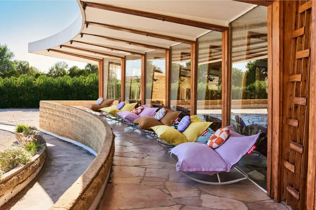 Fatboy bean bags propped up on the Fatboy Rock’n Roll base, placed on a balcony area.