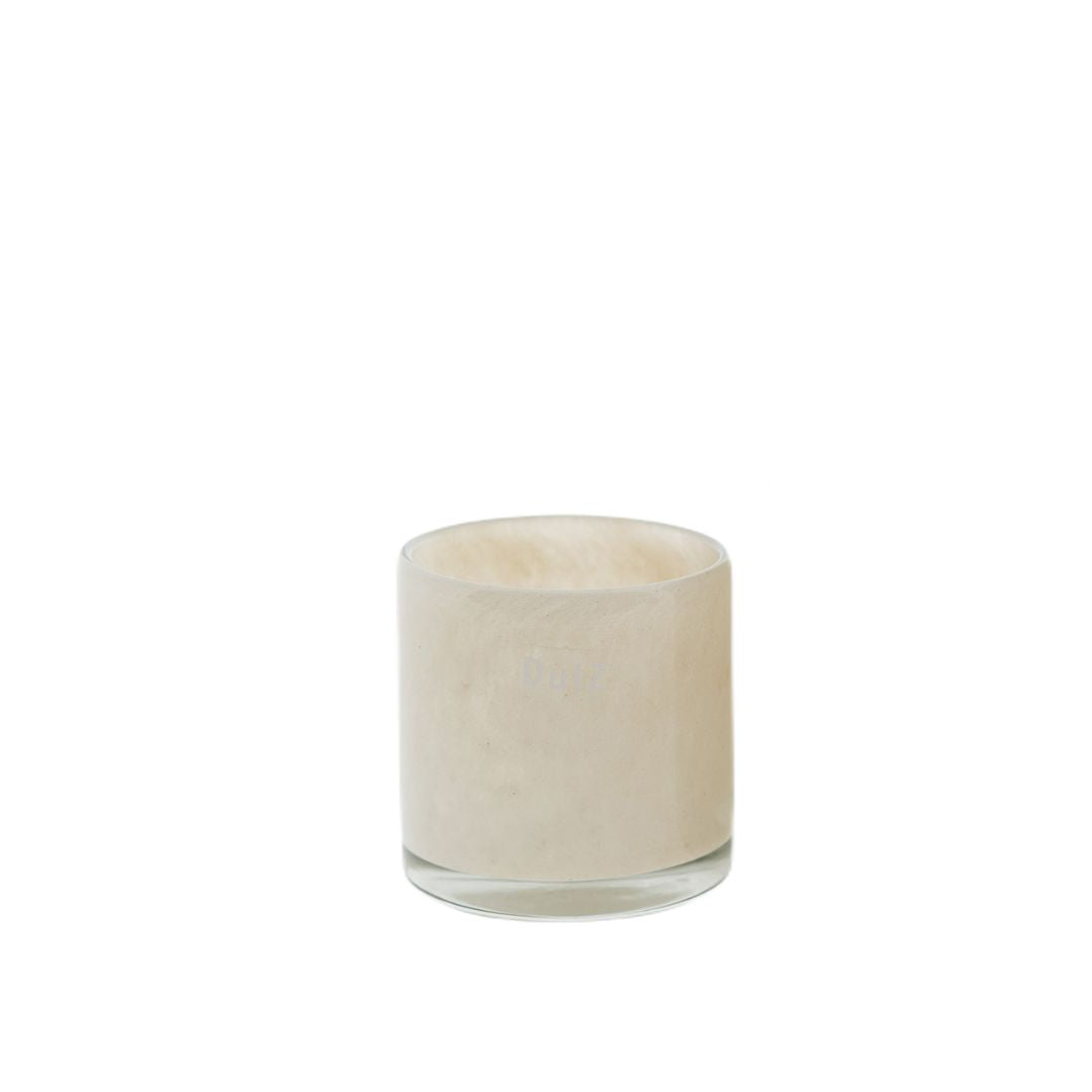 DutZ cream-colored glass votive candle holder with smooth cylindrical shape and thick handblown glass, ideal for tealights or decorative accents.