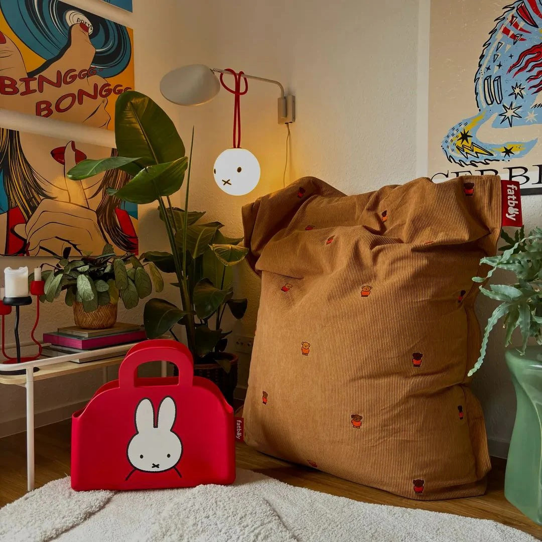 Fatboy Original Slim Recycled Cord x Miffy Bean Bag styled, Fatboy Sjopper-Kees Miffy tote bag and Bolleke hanging light styled in an indoor space.