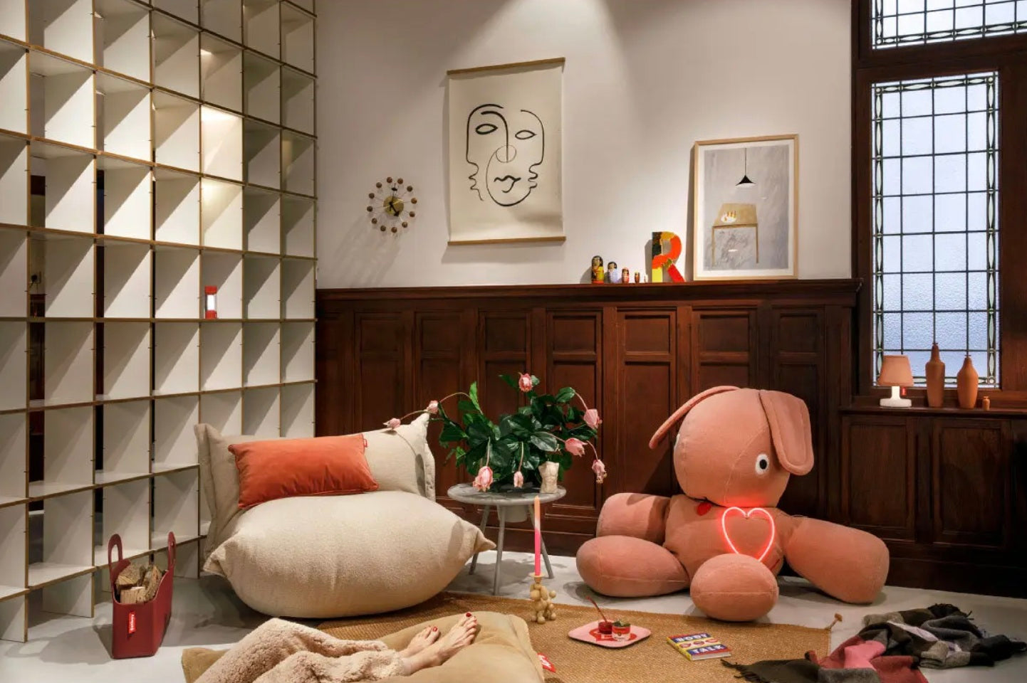 Fatboy Co9 Teddy bean bag in pink styled in a cosy modern living room with wooden panel walls and soft neutral decor