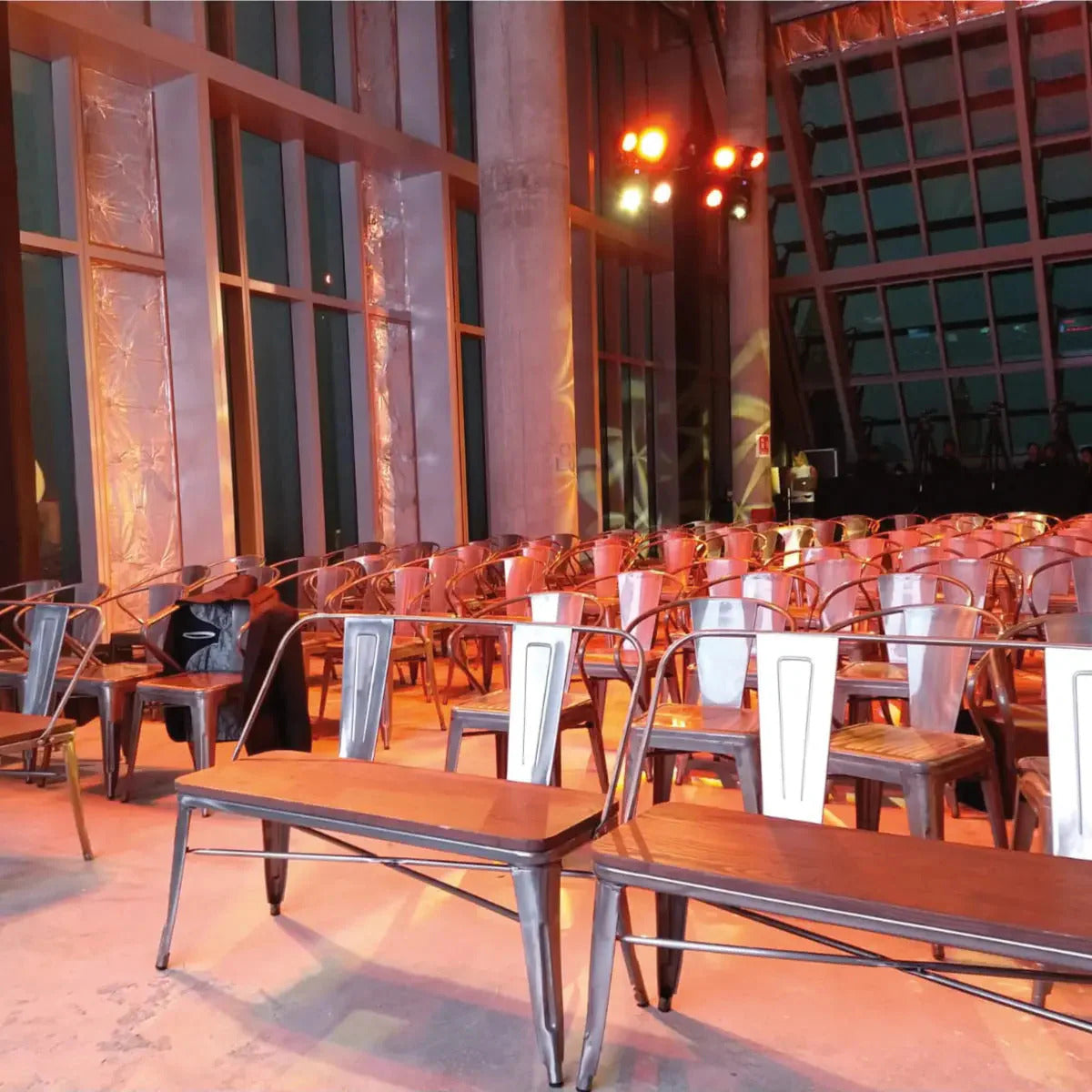 Loft Bench in Gunmetal used as an outdoor bench at an indoor event setup.