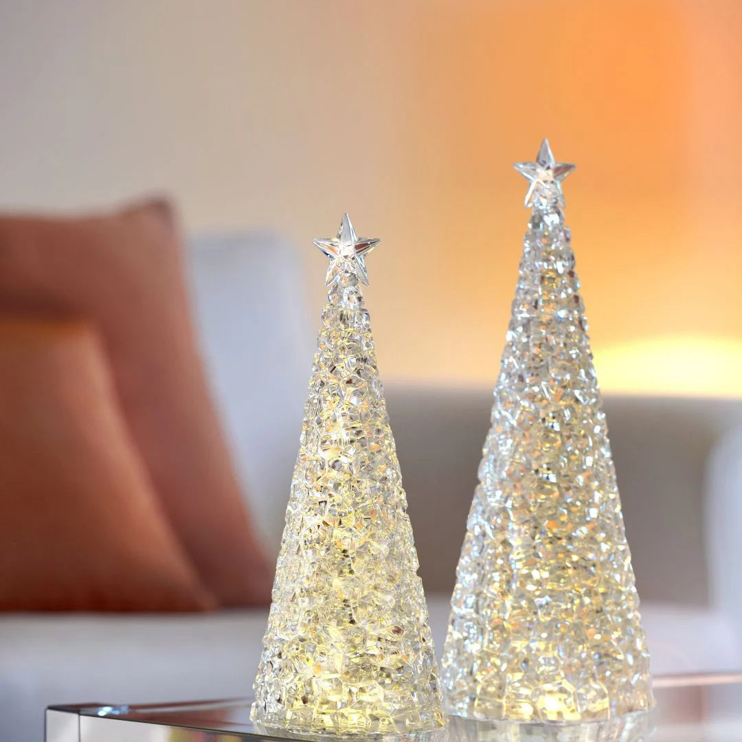Thoughtful gift ideas for those who love to host gatherings include the decorative Sompex Glamor Christmas Tree lamp in silver, red, or green.