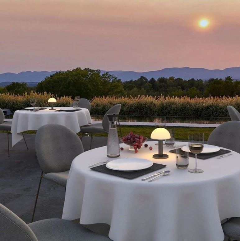 Villeroy and Boch Bergamo table lamps are used as ambient lighting for an outdoor fine dining setup.