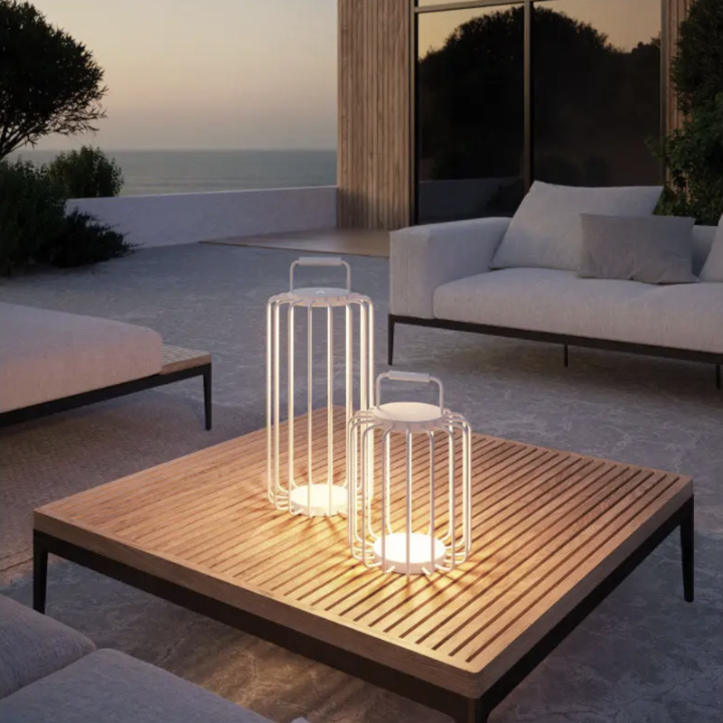 Villeroy & Boch modern floor lamps on outdoor coffee table at sunset, ideal for Dubai terraces or living rooms seeking soft designer lighting.